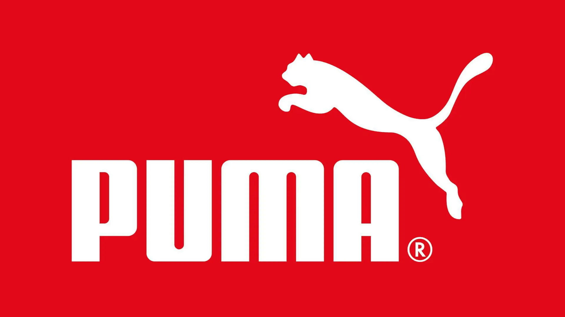 An eye-catching red background showcases the iconic Puma logo, a symbol of high-quality sports apparel. Join the Puma Affiliate Program now to earn commission on every sale!