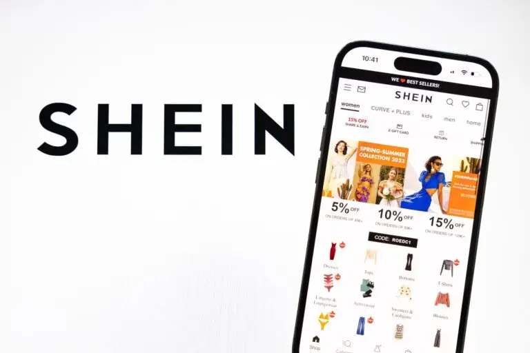 A cell phone displaying a website, serving as a potential source to promote Shein's products and earn money through shein affiliate marketing.