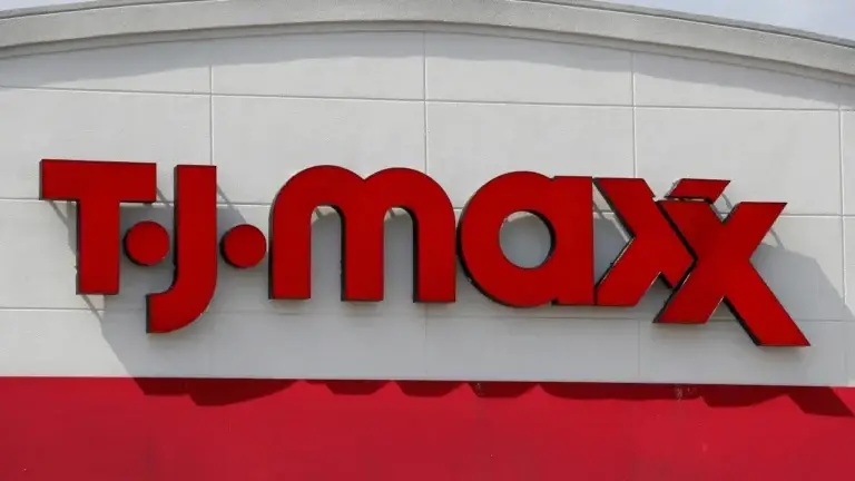 A TJ Maxx sign is seen on the side of a building promoting the TJ Maxx Affiliate Program.