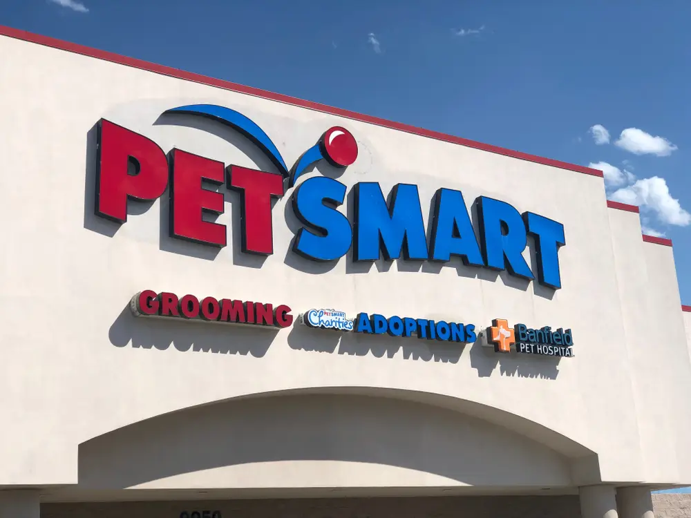 Exterior signage of a PetSmart store advertising grooming, adoptions, and Banfield Pet Hospital services. PetSmart Affiliate program