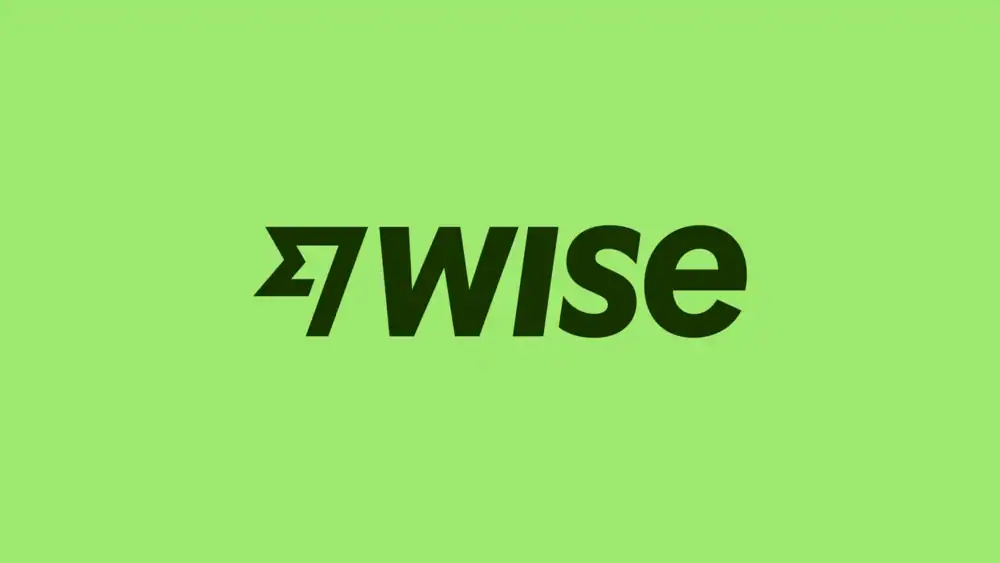 The Wise logo in bold black text with a stylized arrow icon, centered on a light green background, represents the smartest way to transfer money. - Prime Affiliate Reviews — Trusted, Honest Support The Wise logo in bold black text with a stylized arrow icon, centered on a light green background, represents the smartest way to transfer money.